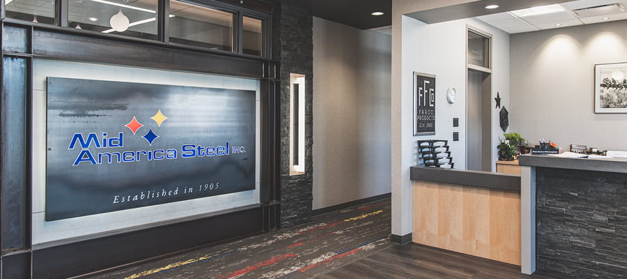 Mid America Steel front reception area with custom lazer cut steel sign