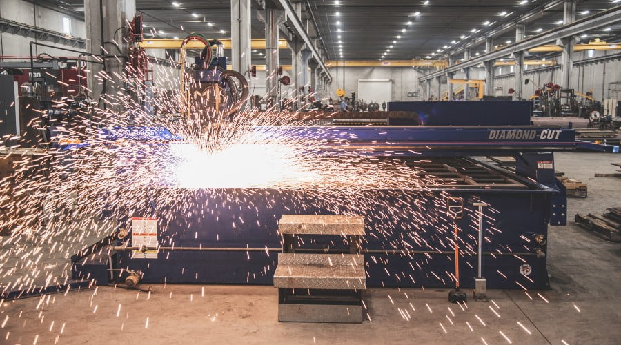 CNC Table cutting metal with sparks flying
